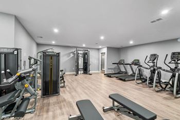 Fitness center with free weights and cardio machines
